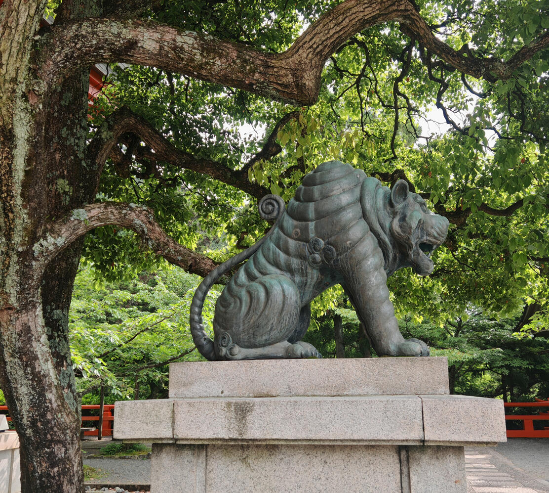 The A-UN tigers represent the beginning and end of all things, encapsulating the entire universe within their symbolic presence.